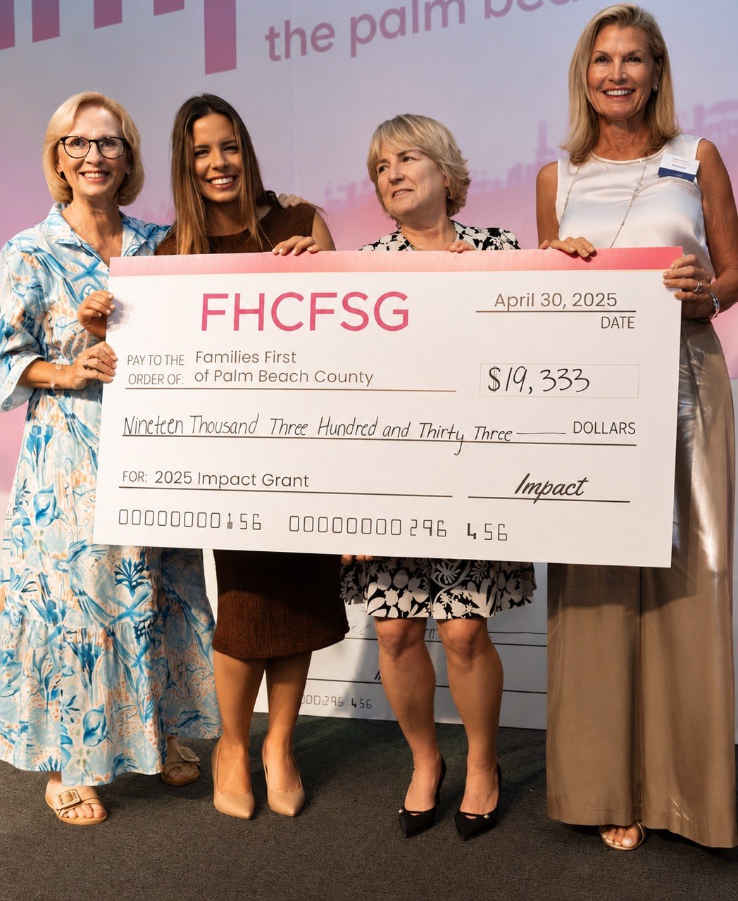 Families First of Palm Beach County receiving a grant check