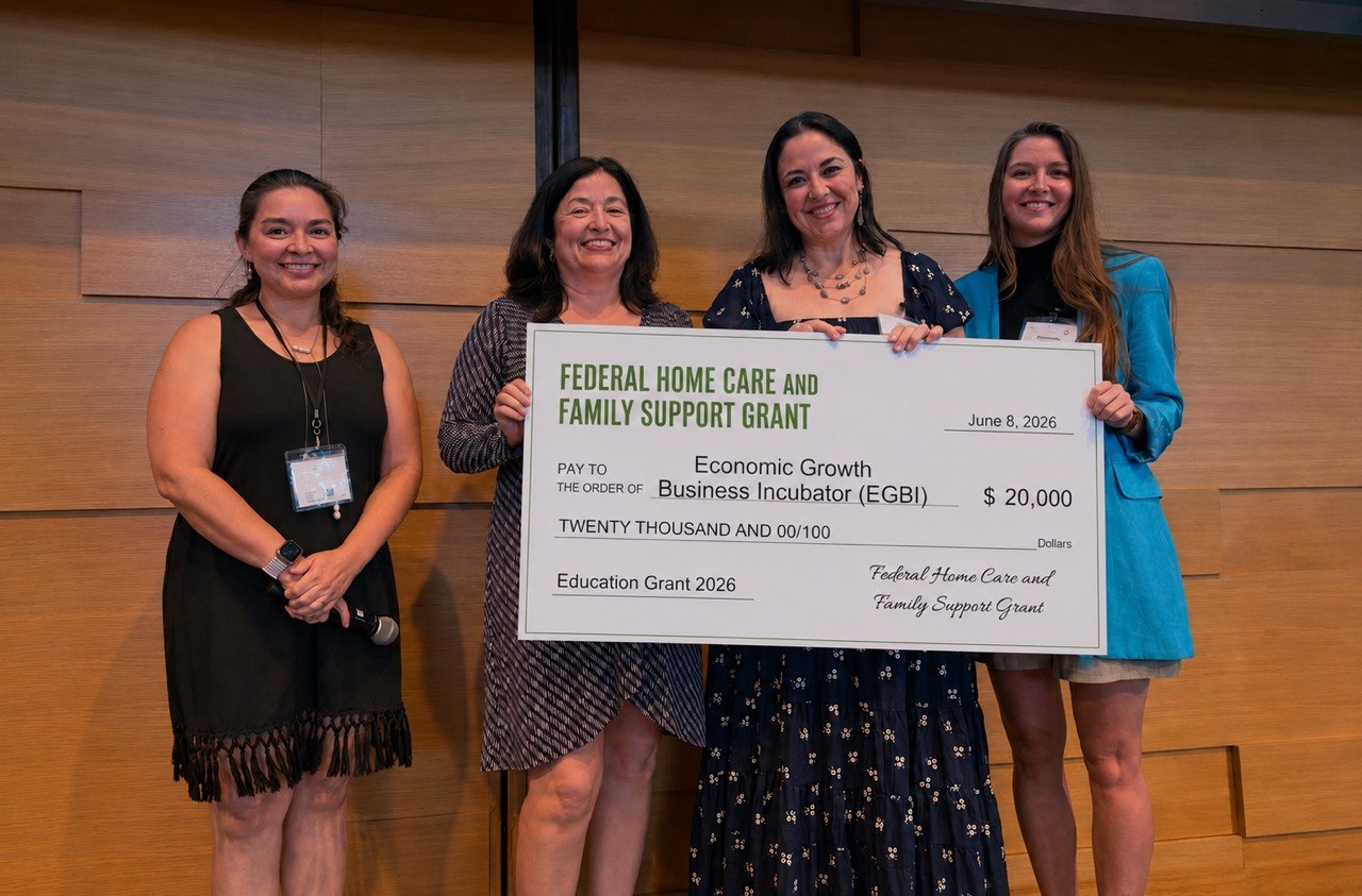 Economic Growth Business Incubator (EGBI) receiving a grant check