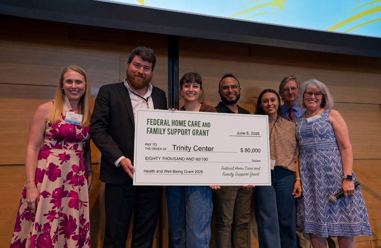Trinity Center receiving a grant check